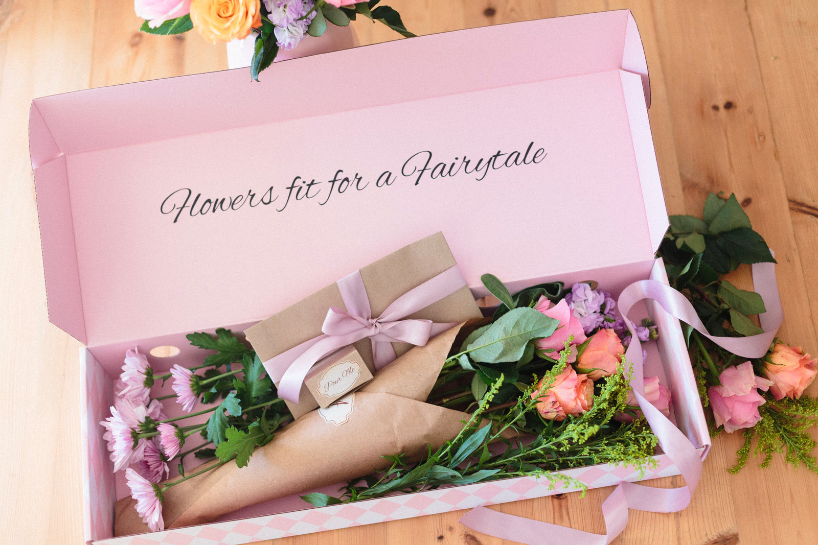 Alice in Bloom open gift box with flowers